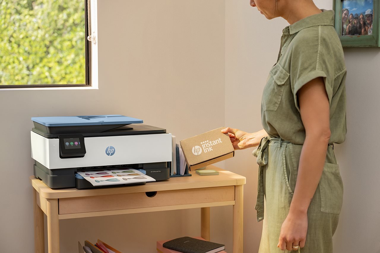 Woman filling a printer with ink