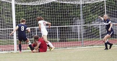 Taylor Fulcher of Appomattox (right) pleads for a goal call as goalie Laura Whitaker (red) of George Mason attempts to secure the ball