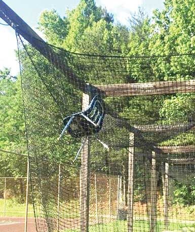 Chair in softball pitching net