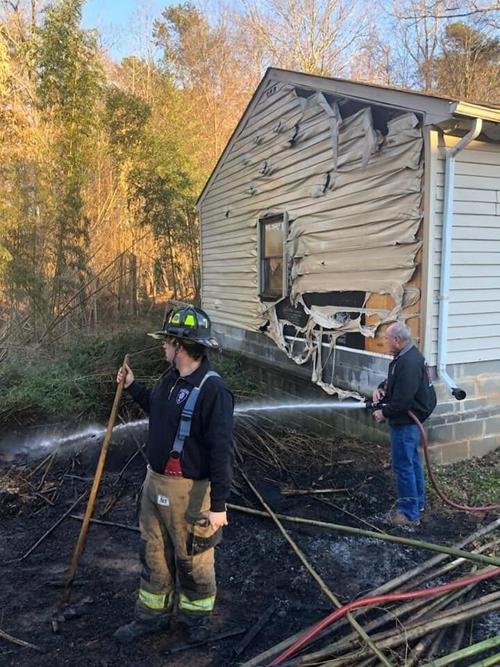 Blaze spreading to building stopped